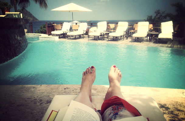 The author poolside, nourishing her natal Moon with words and travel.