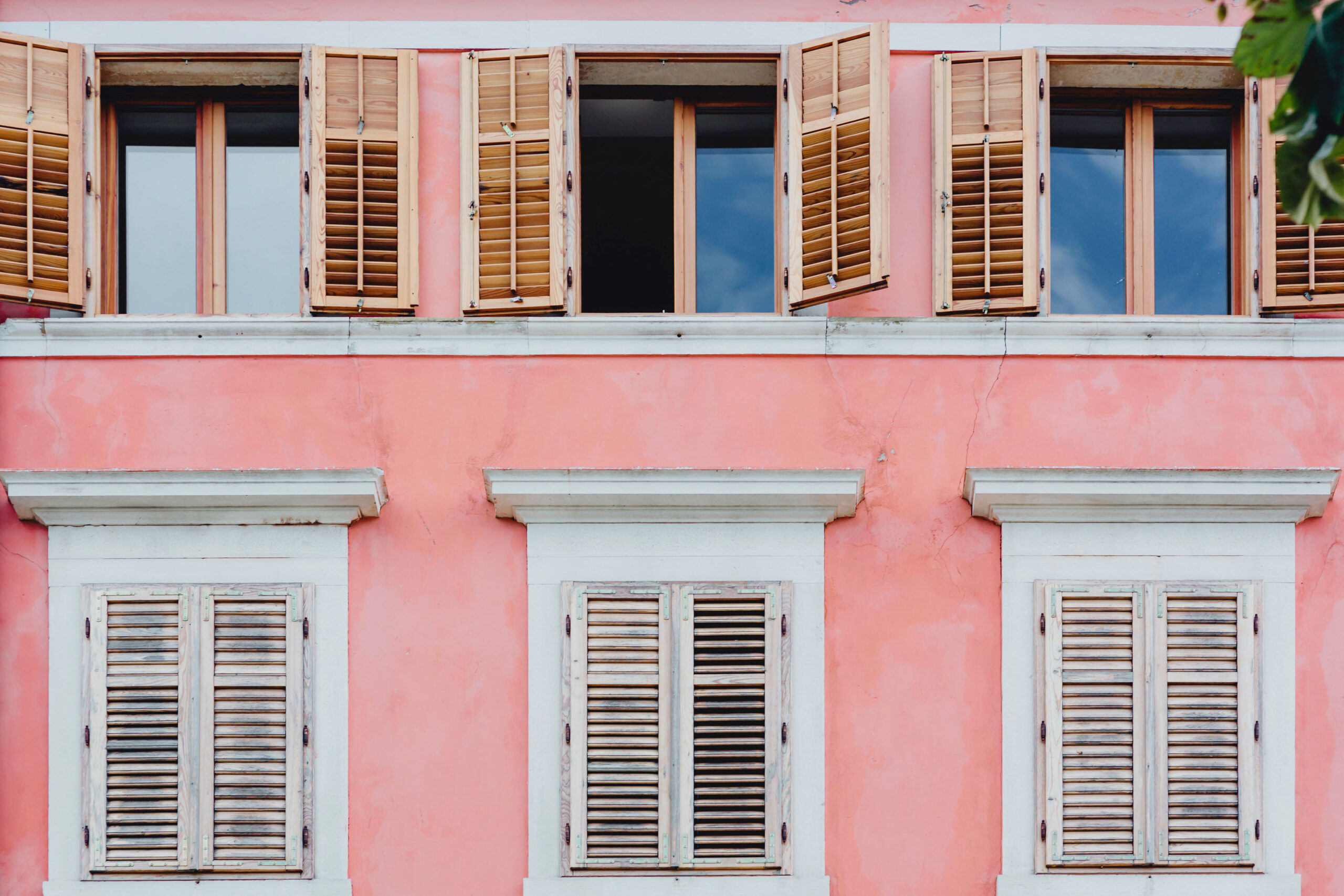 Windows on pink building.