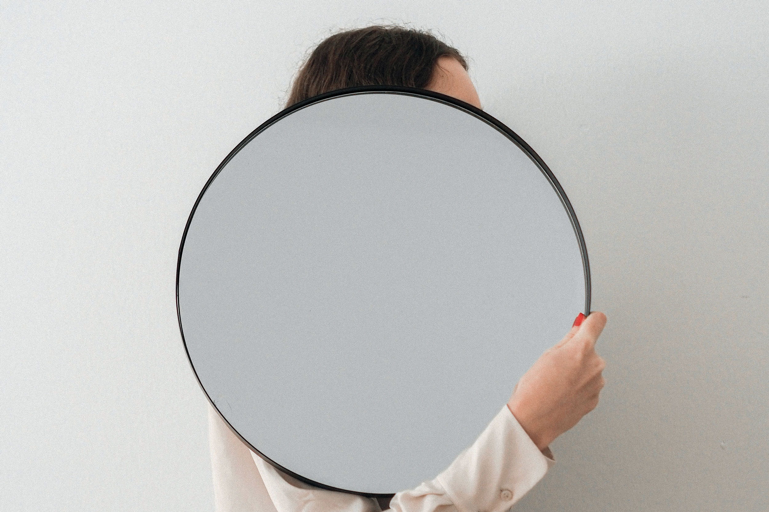 Woman holding a mirror