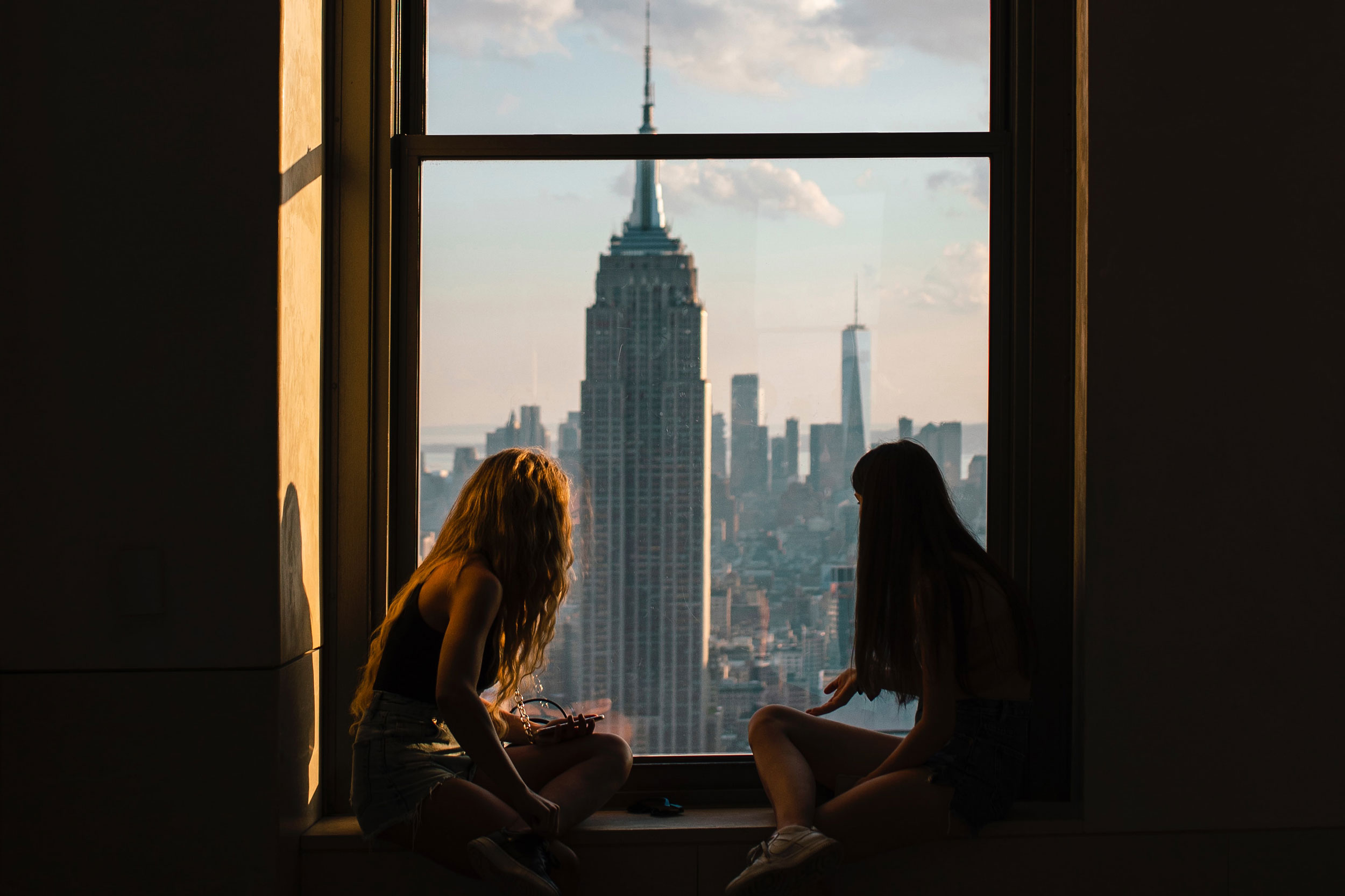 Two women looking at the Empire State Building